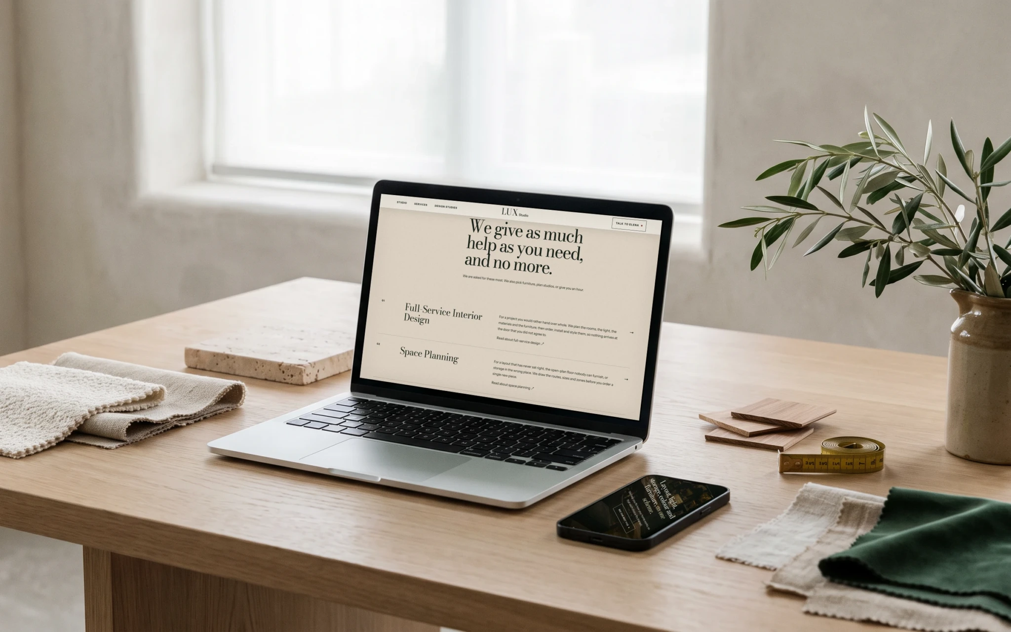 LUX Studio, a residential interiors website I designed: its services, on a laptop and a phone.