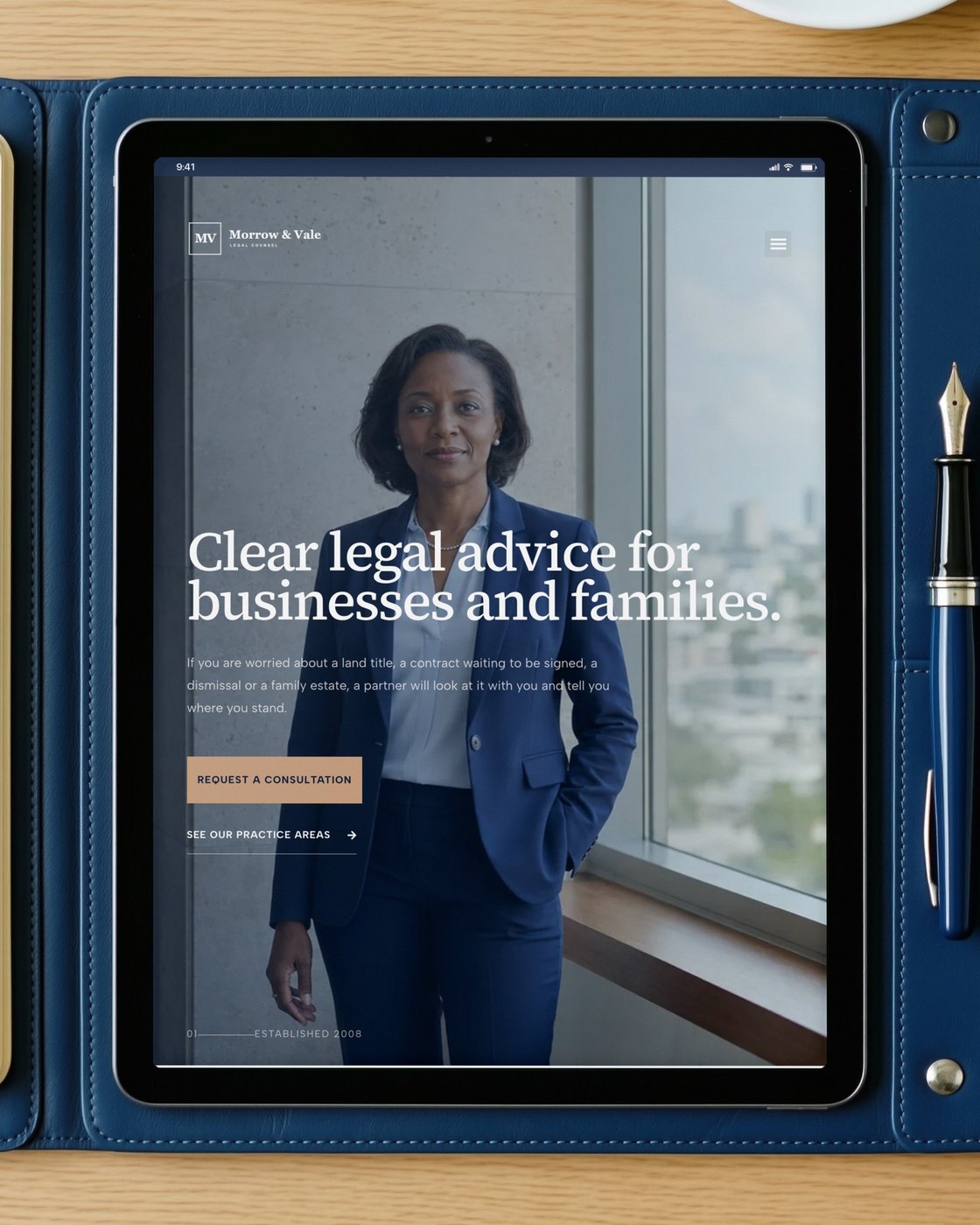 The Morrow and Vale homepage on an iPad in a navy leather folio