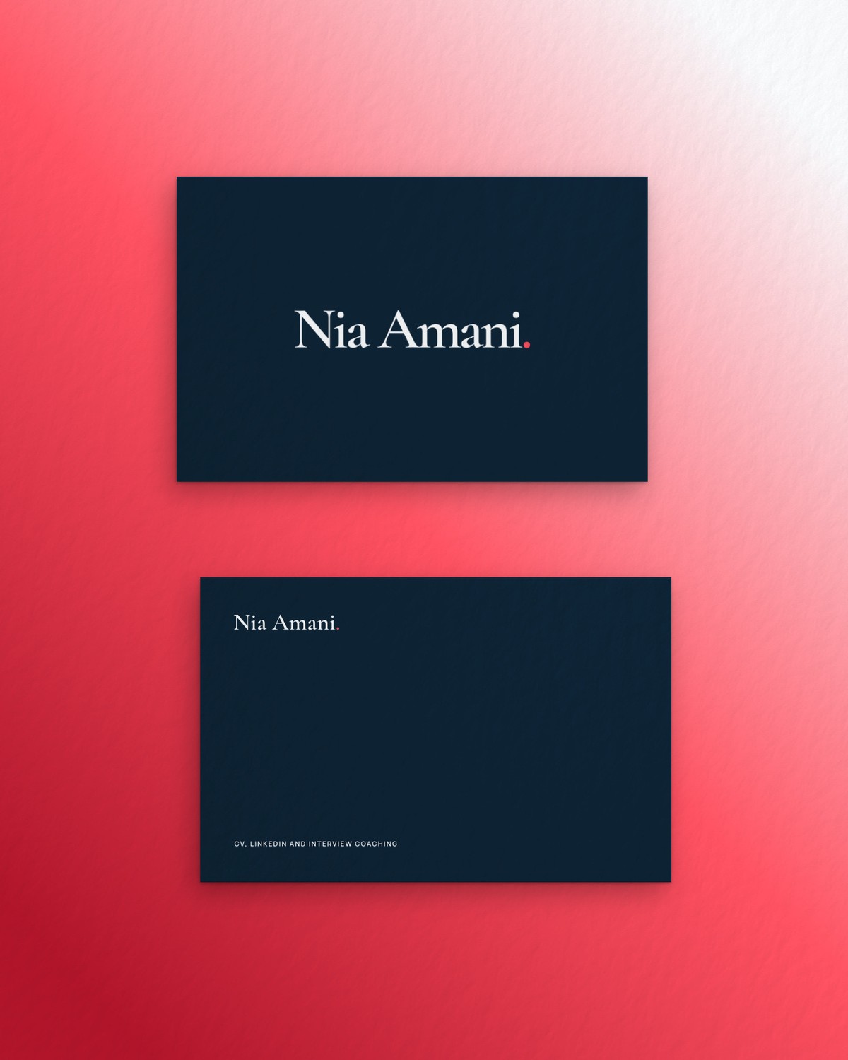 Navy Nia Amani business cards on a red ground