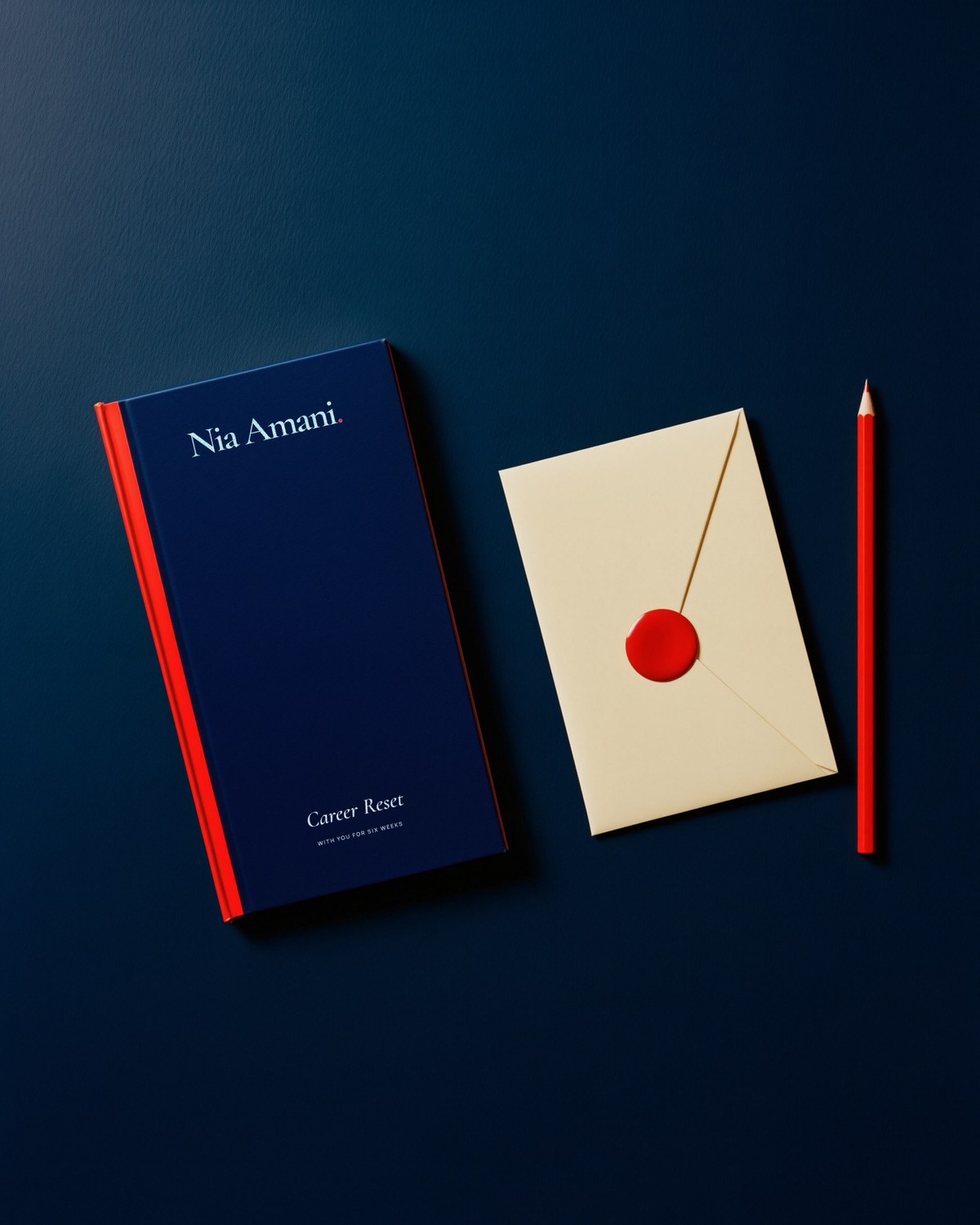 The navy Career Reset workbook beside an envelope with a red wax seal