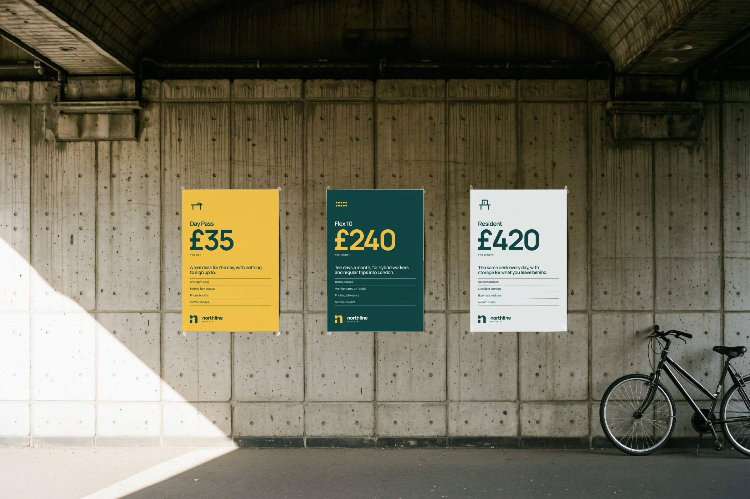 Northline Works: three plan posters under a concrete arch